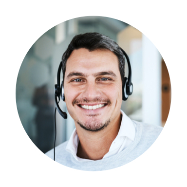 Image of man smiling and talking on a headset