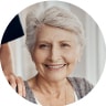 Image of older woman with caregivers hand on shoulder