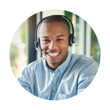 Man wearing headset smiles towards camera