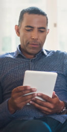 Man looking at tablet