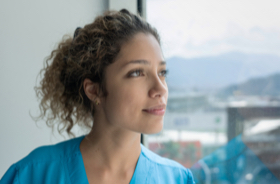 woman staring out a windwo