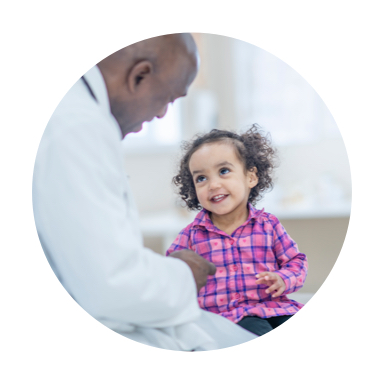 Image of doctor giving care to smiling child