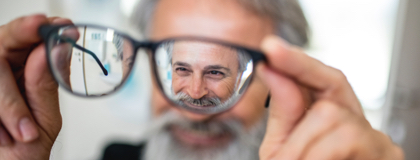 Image: Glasses bringing smiling man into focus