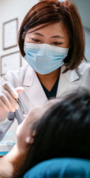 Image: Dental professional performing exam