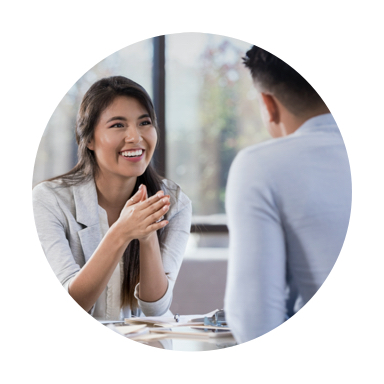 Image of woman smiling speaking with care giver