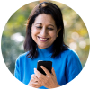 A woman with long, dark hair looking at mobile phone