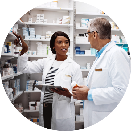 Two pharmacists having a conversation in a pharmacy