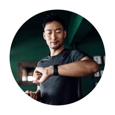 man looks at fitness watch