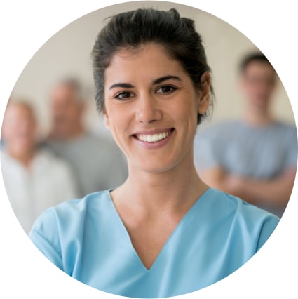 Image smiling medical professional in scrubs