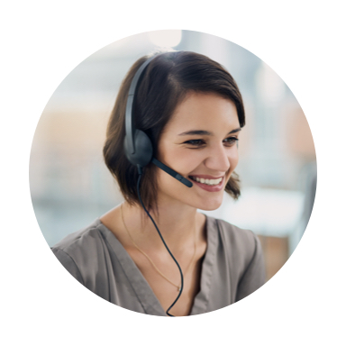 Woman wearing a headset smiles away from the camera